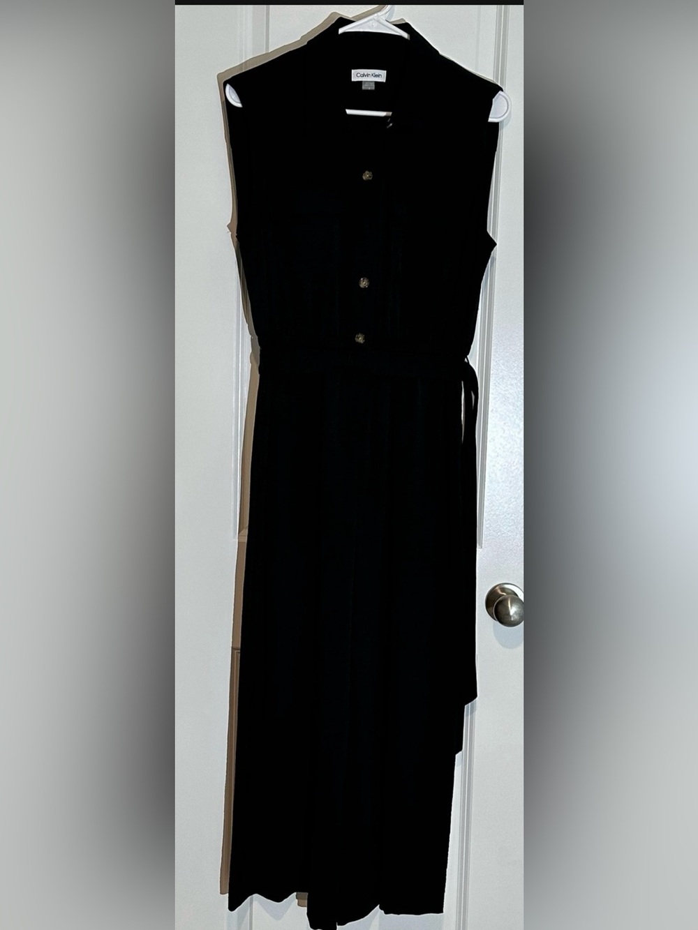 Classic black jumpsuits and rompers: a timeless feminine garment.